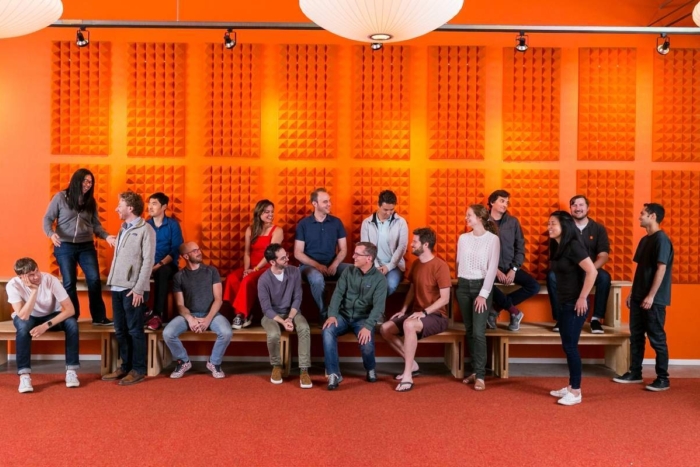Y Combinator team with an orange background
